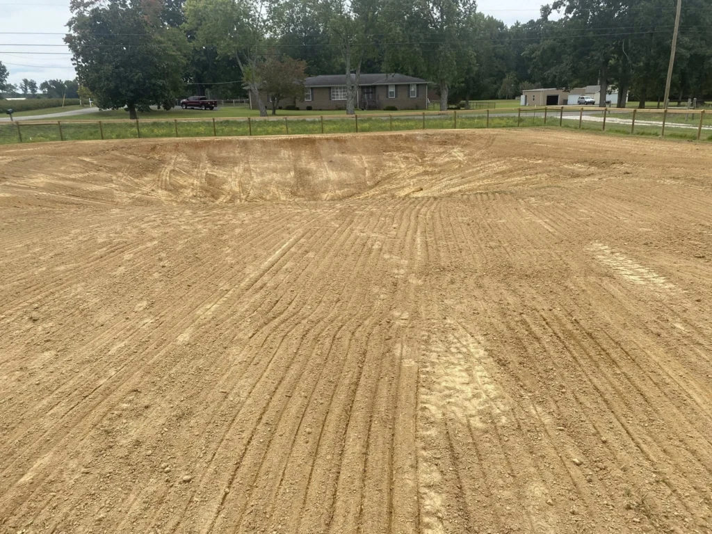 Excavation of soil and installation of compacted gravel base for concrete slab