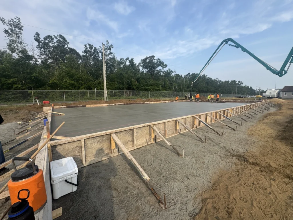 Engineered garage pad with stamped drawings, detailed reinforcement plan, and drainage design
