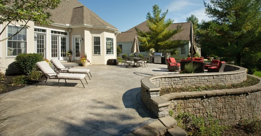 Concrete patios in Edmonton designed as a backyard outdoor living space with durable concrete finish
