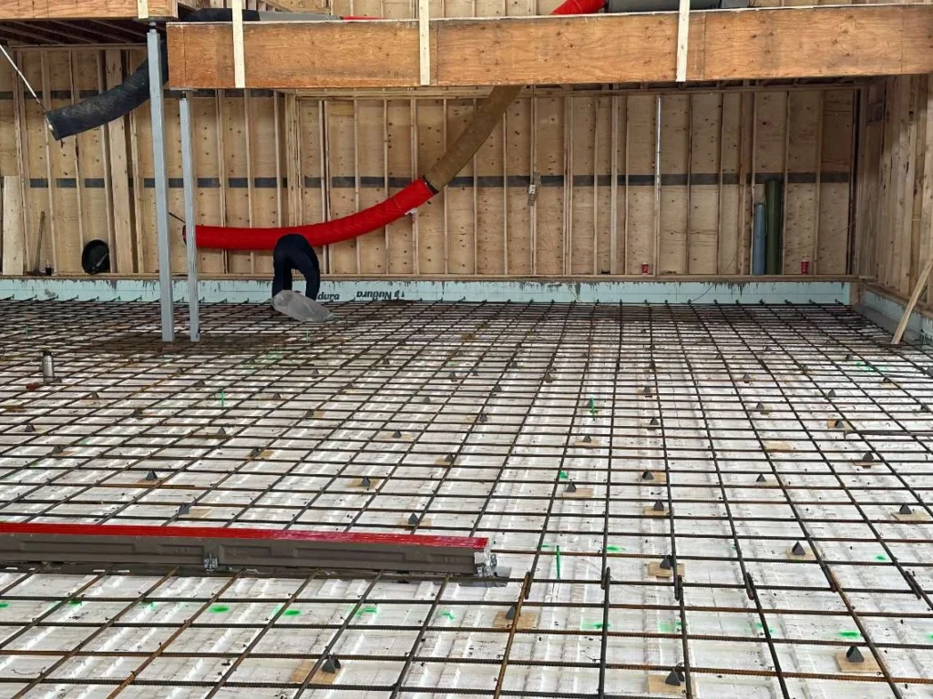 Frost-protected garage pads in Edmonton using insulation and reinforced rebar grid